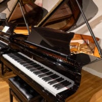 Steinway & Sons grand piano in ebony finish, showcasing premium craftsmanship at Classic Pianos Denver showroom.