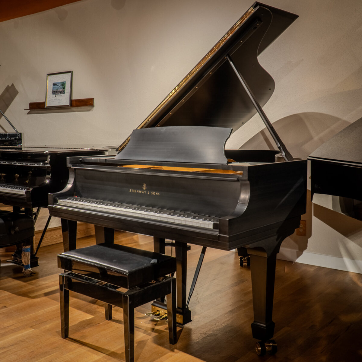 Steinway & Sons grand piano in satin black finish, showcasing expert craftsmanship and premium materials at Classic Pianos Denver.