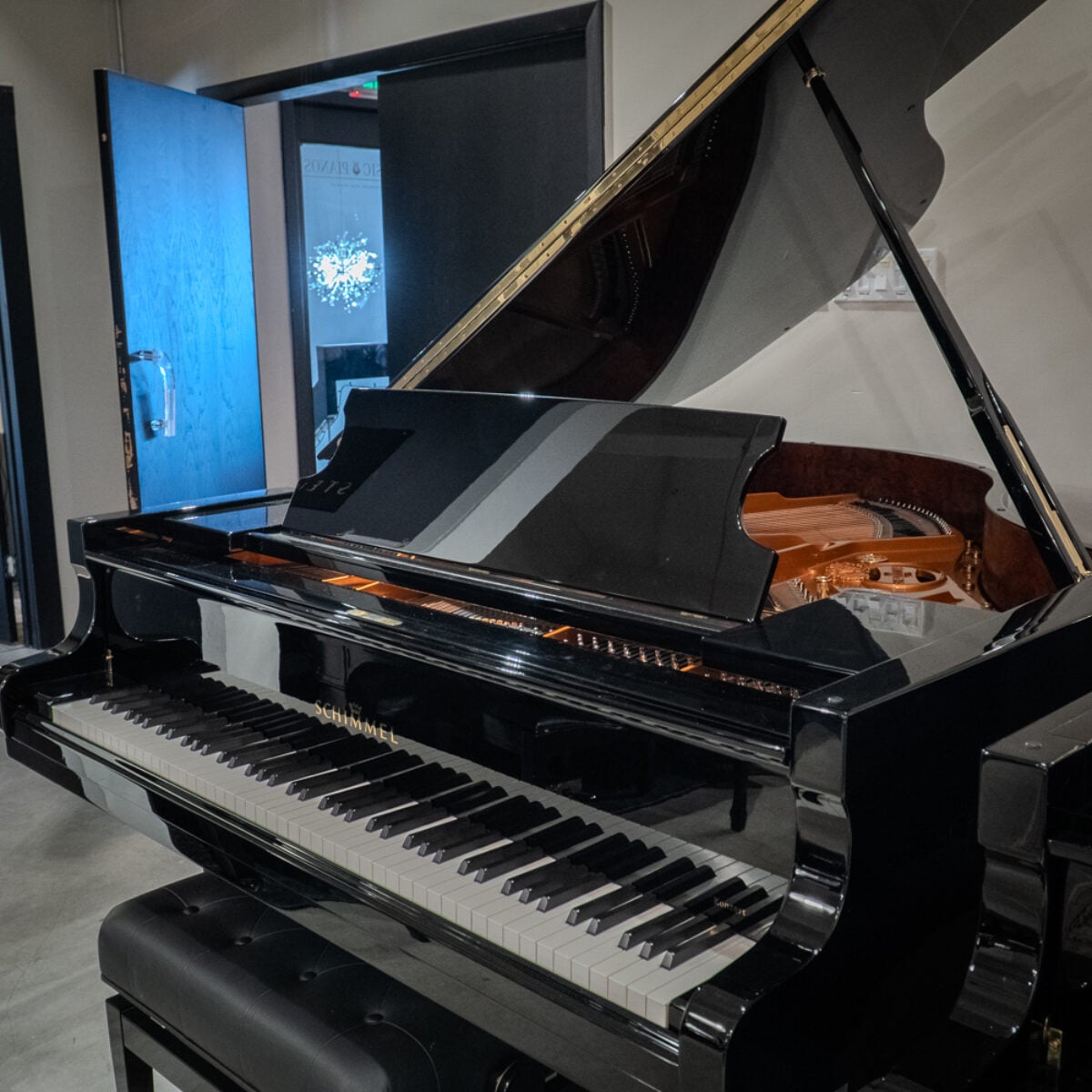 Elegant Schimmel grand piano showcasing high-gloss finish and premium craftsmanship. Perfect for discerning musicians at Classic Pianos.