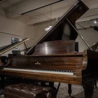 Alt text: Steinway & Sons grand piano with rich mahogany finish, showcasing craftsmanship and premium sound quality at Classic Pianos.