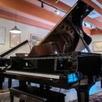Yamaha grand piano showcasing polished ebony finish and exquisite craftsmanship, perfect for any music lover.
