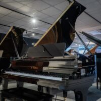 Alt text: Kawai grand piano showcasing polished ebony finish and expert craftsmanship, perfect for professional musicians.