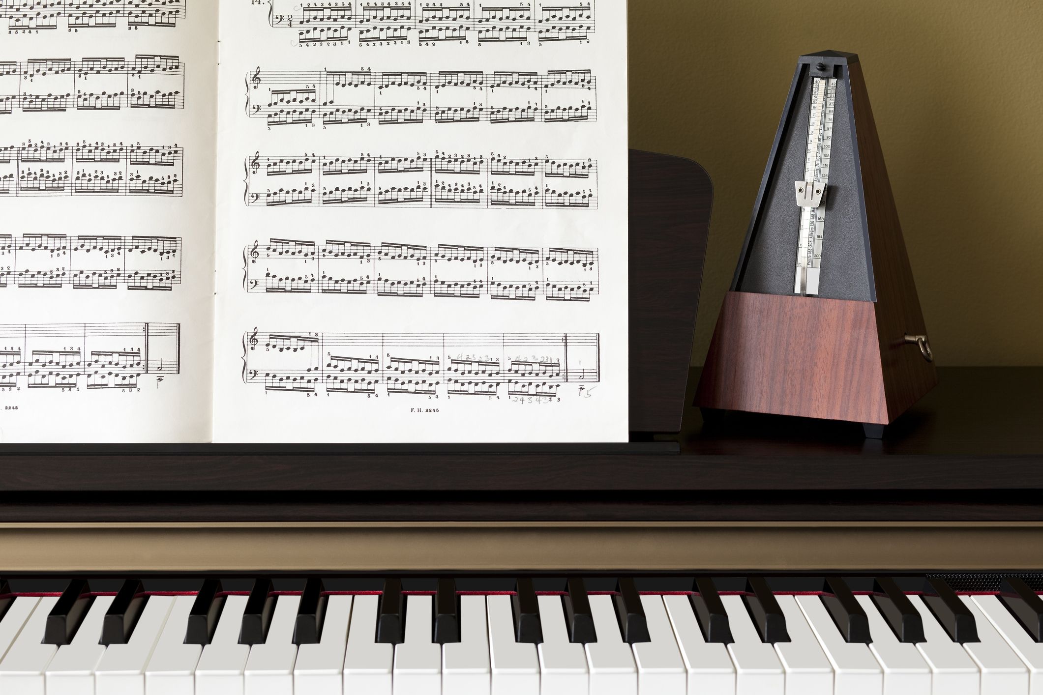 Introducing the Bösendorfer 230VC Grand piano with sheet music and metronome